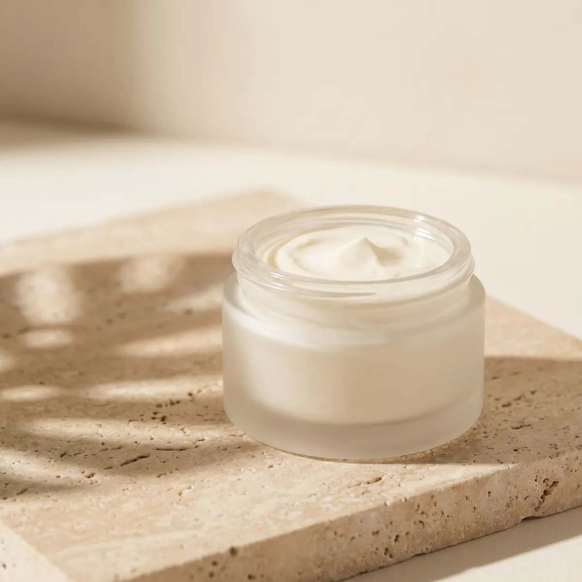 Cream jar on travertine — AI product photography